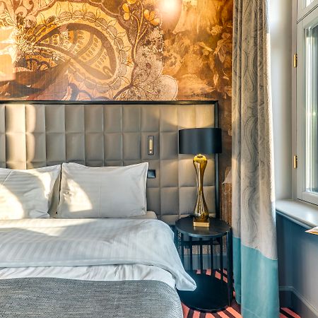 Grand Poet Hotel And Spa By Semarah Riga Bagian luar foto A room at the hotel