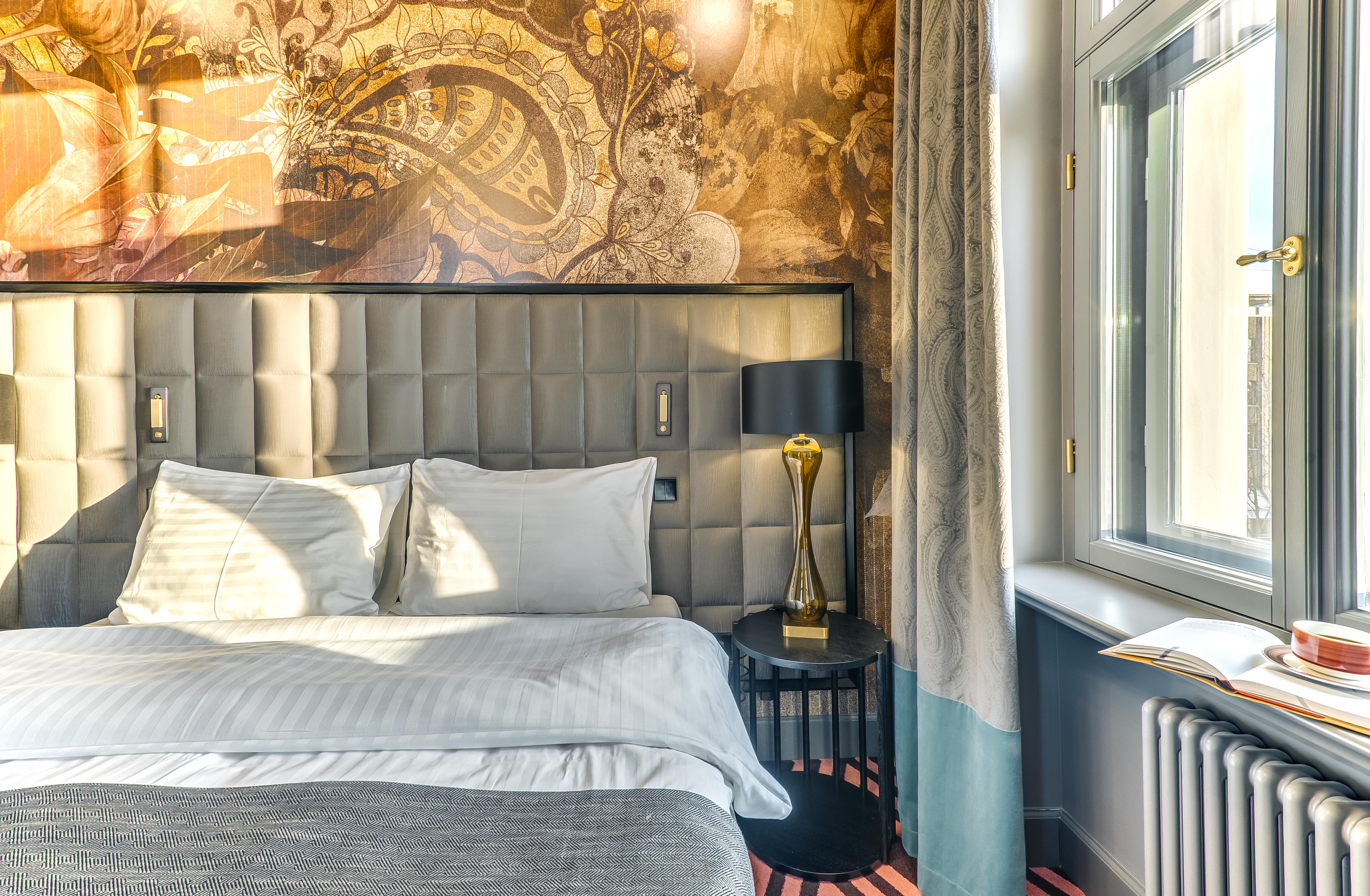 Grand Poet Hotel And Spa By Semarah Riga Bagian luar foto A room at the hotel
