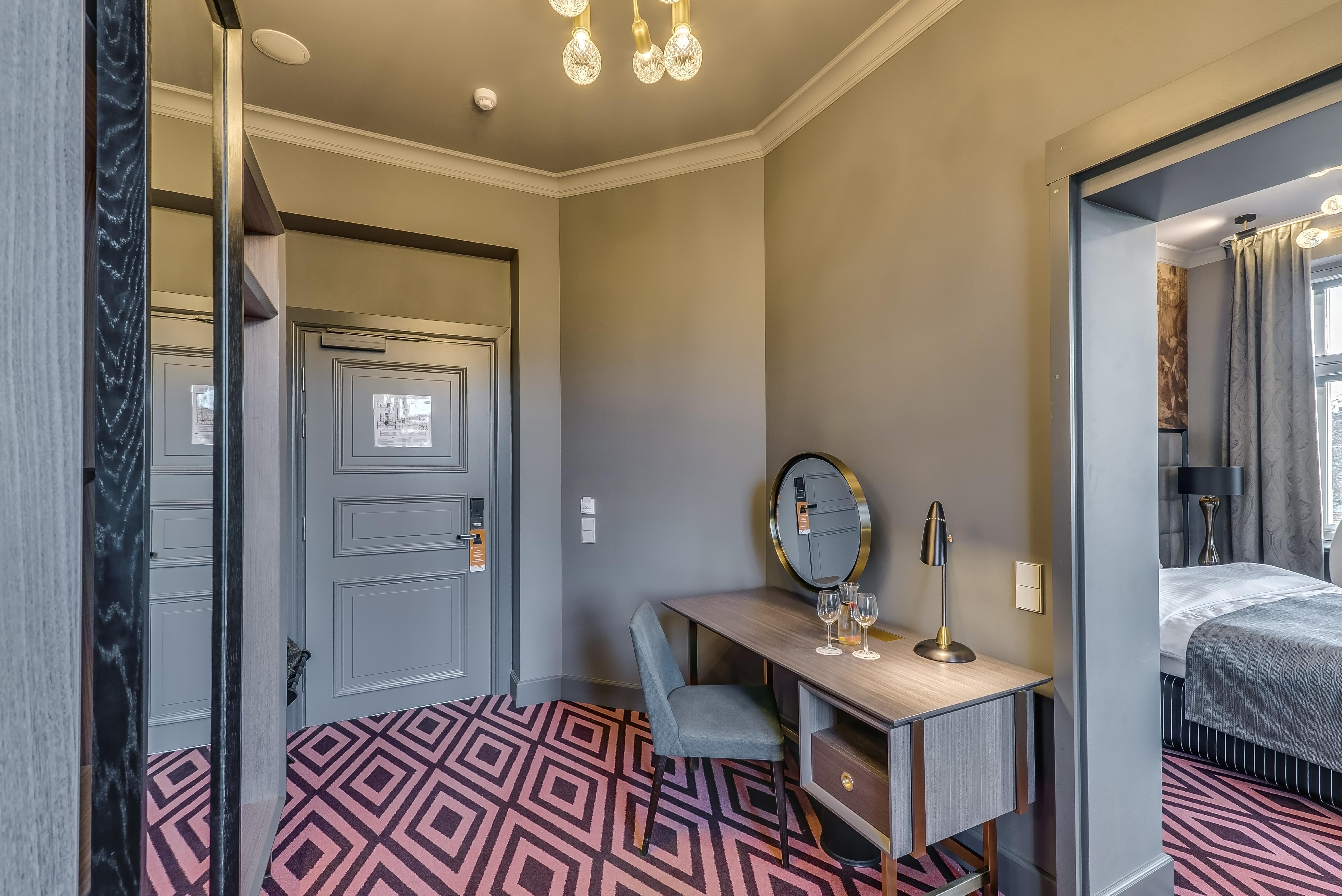 Grand Poet Hotel And Spa By Semarah Riga Bagian luar foto A room at the hotel