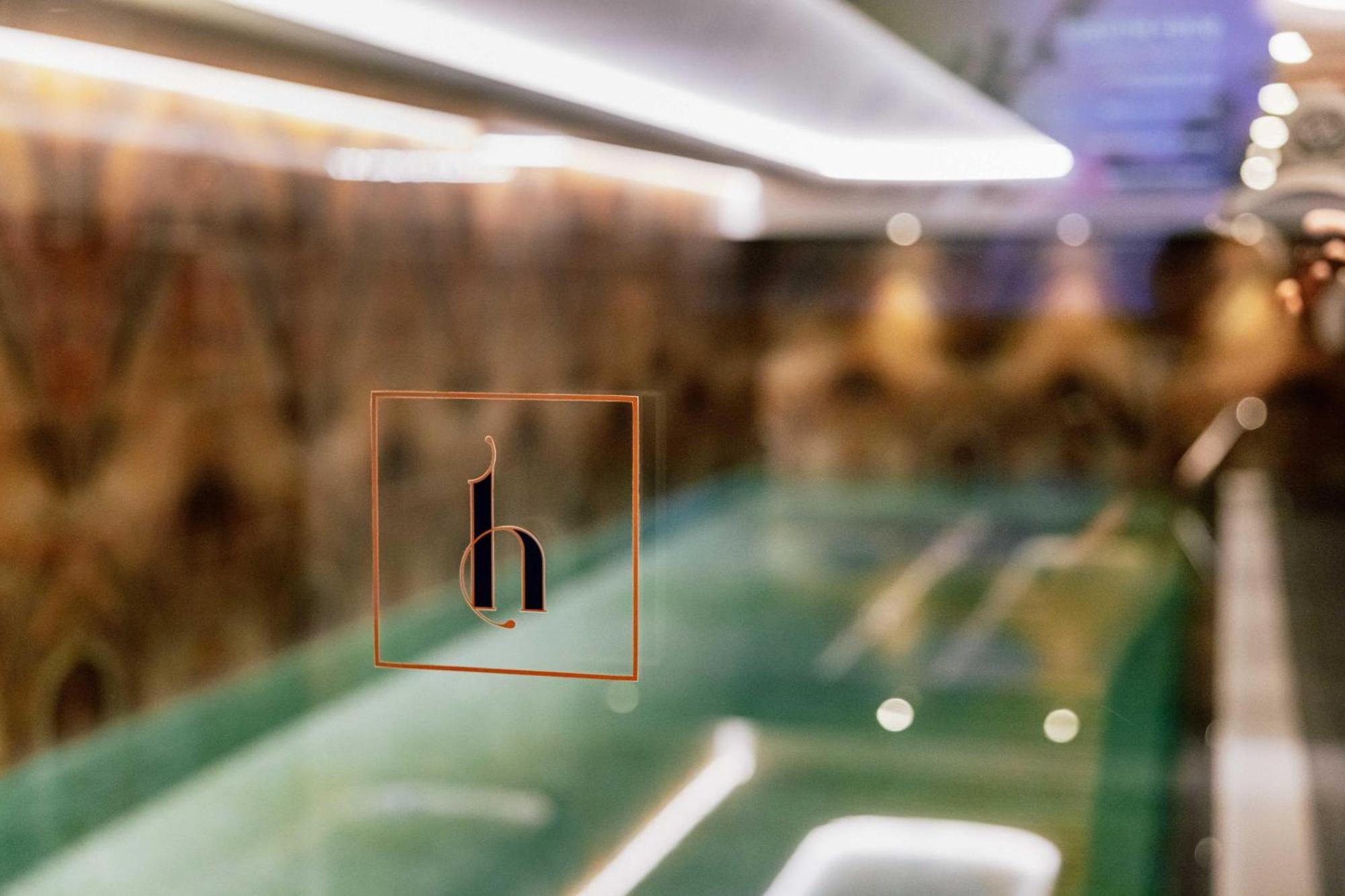 Grand Poet Hotel And Spa By Semarah Riga Bagian luar foto The logo of the hotel