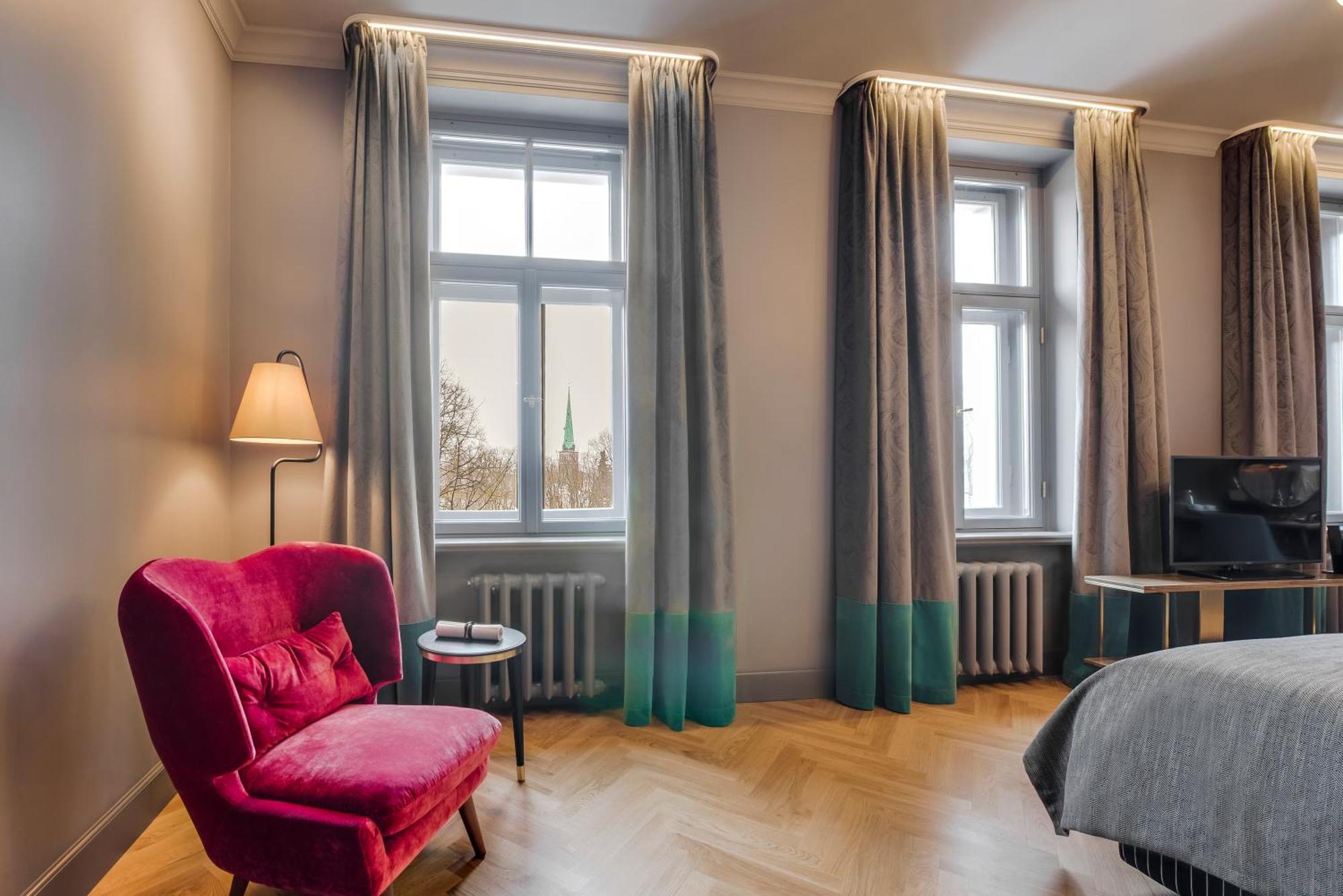 Grand Poet Hotel And Spa By Semarah Riga Bagian luar foto A room at the hotel