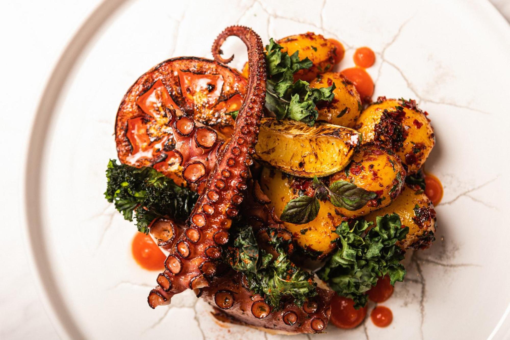 Grand Poet Hotel And Spa By Semarah Riga Bagian luar foto A prepared octopus dish