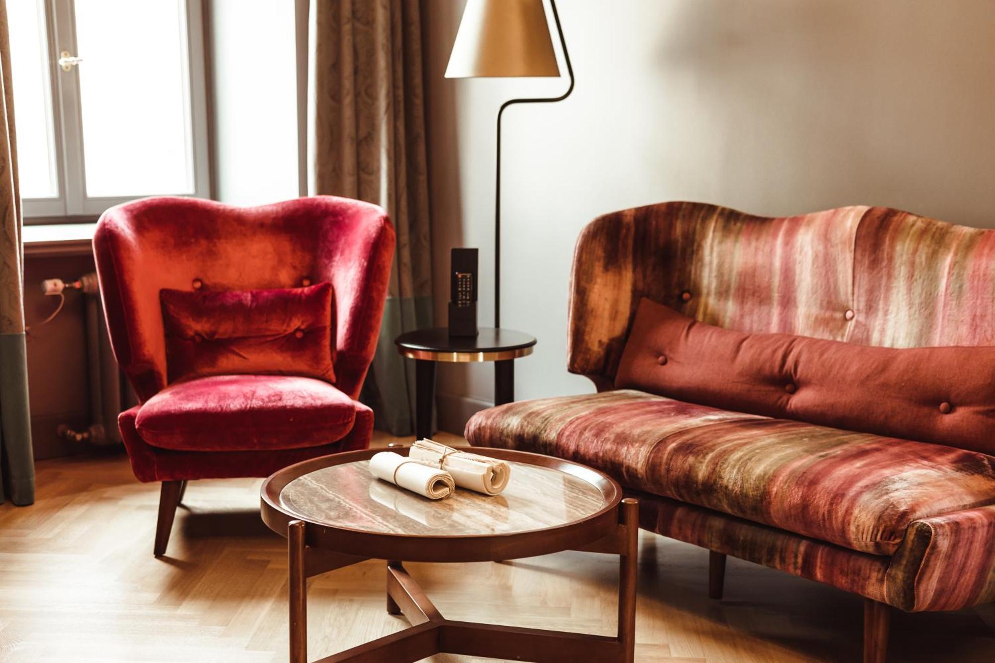 Grand Poet Hotel And Spa By Semarah Riga Bagian luar foto A sofa and armchair upholstered in velvet